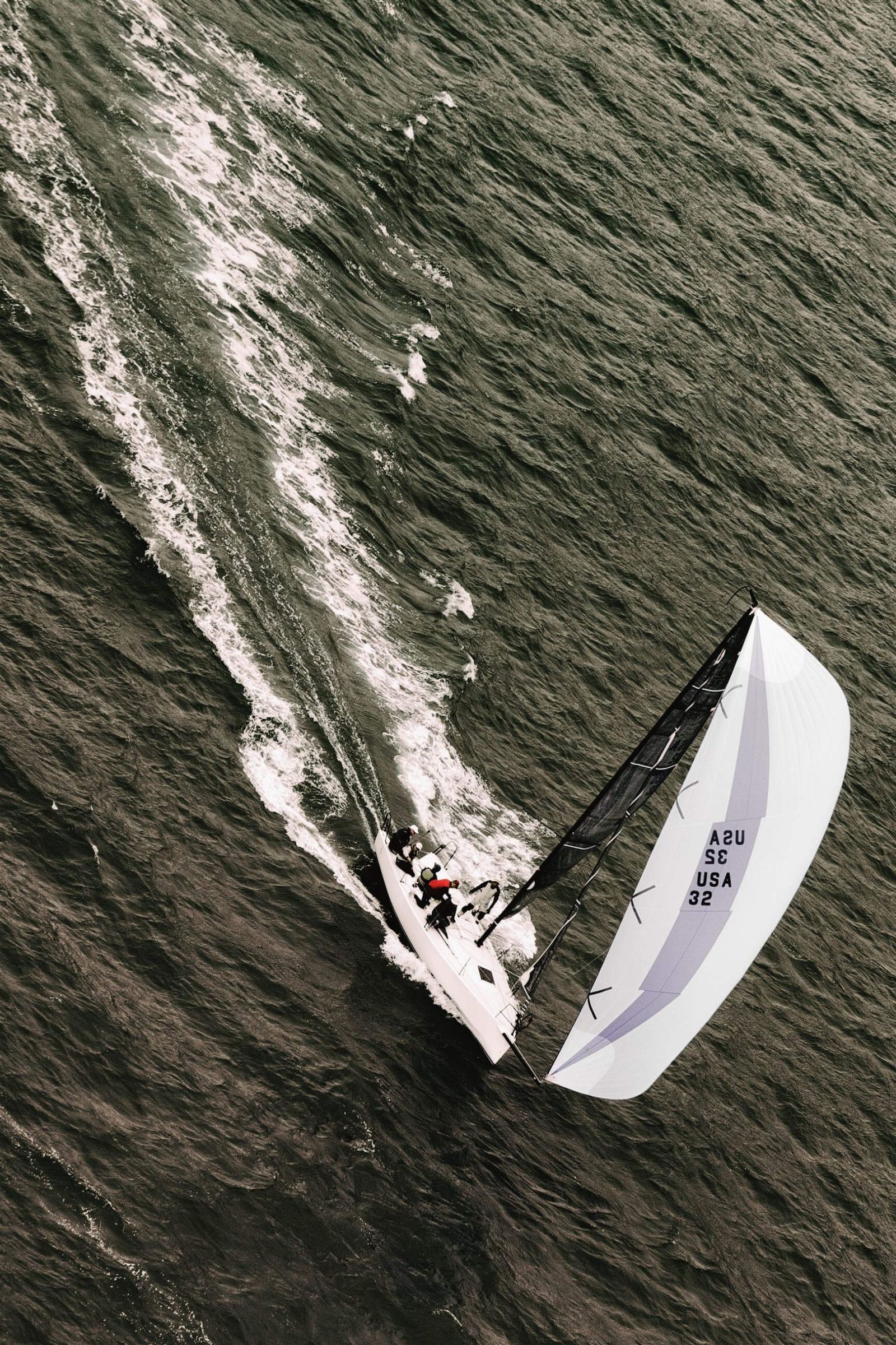 Keelboat racing downwind, seen from above