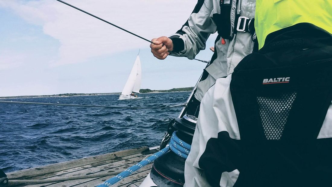 Sailing crew in race gear on deck